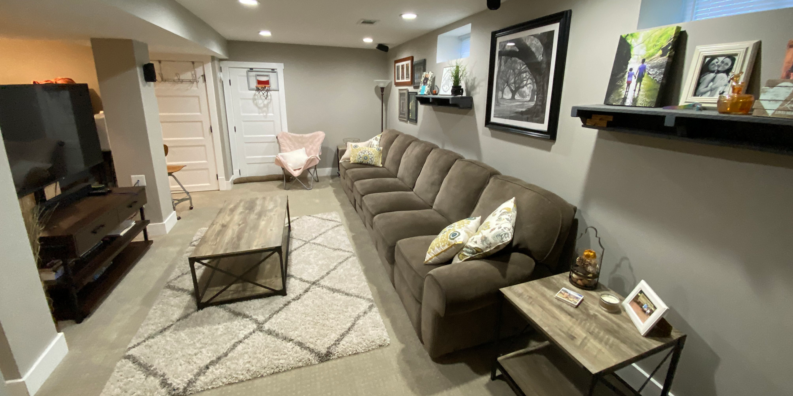 basement with gray couch remodel